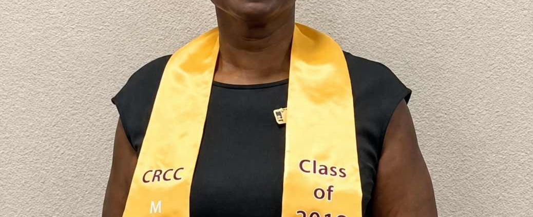 Portrait of Sibyl Gibson wearing a graduation stole during her chaplain ministry journey