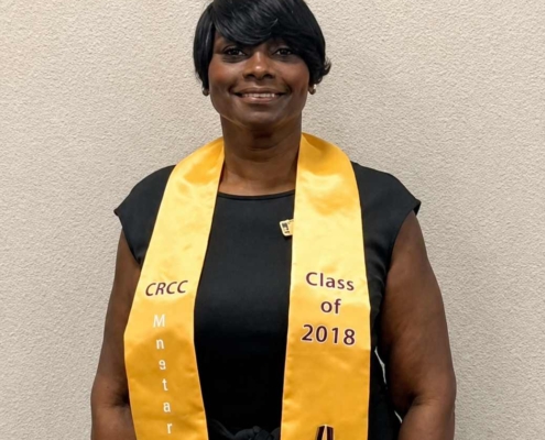 Portrait of Sibyl Gibson wearing a graduation stole during her chaplain ministry journey