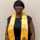 Portrait of Sibyl Gibson wearing a graduation stole during her chaplain ministry journey