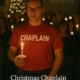 Christmas Chaplain bringing prayer and presence during a candlelight service.