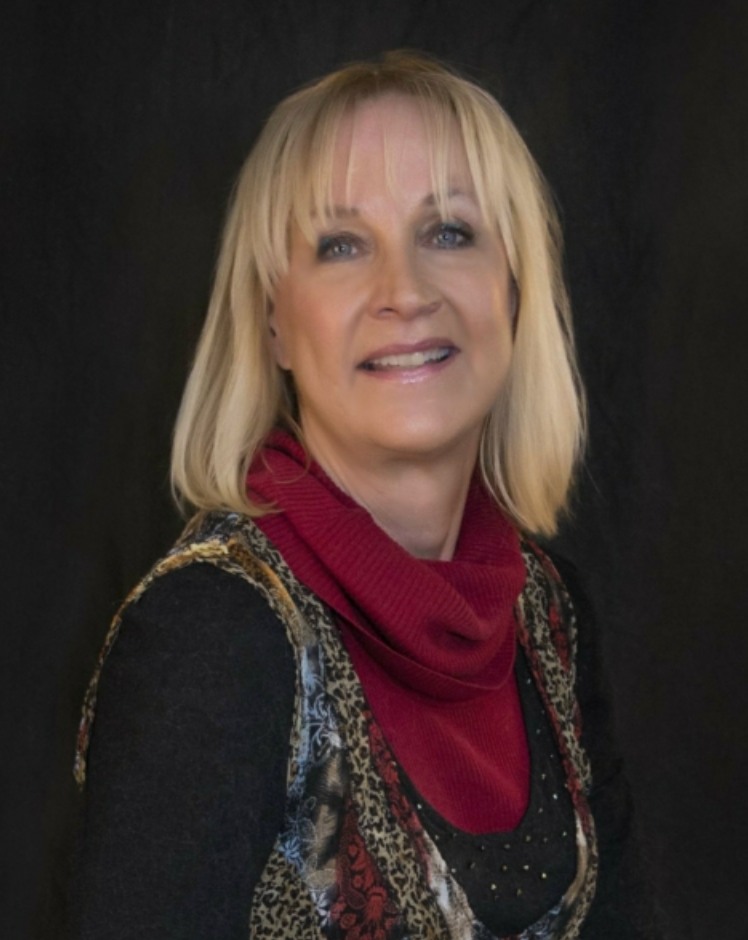 Female chaplain offering spiritual care, prayer, and compassionate support to senior citizens and their families in assisted living or community settings.